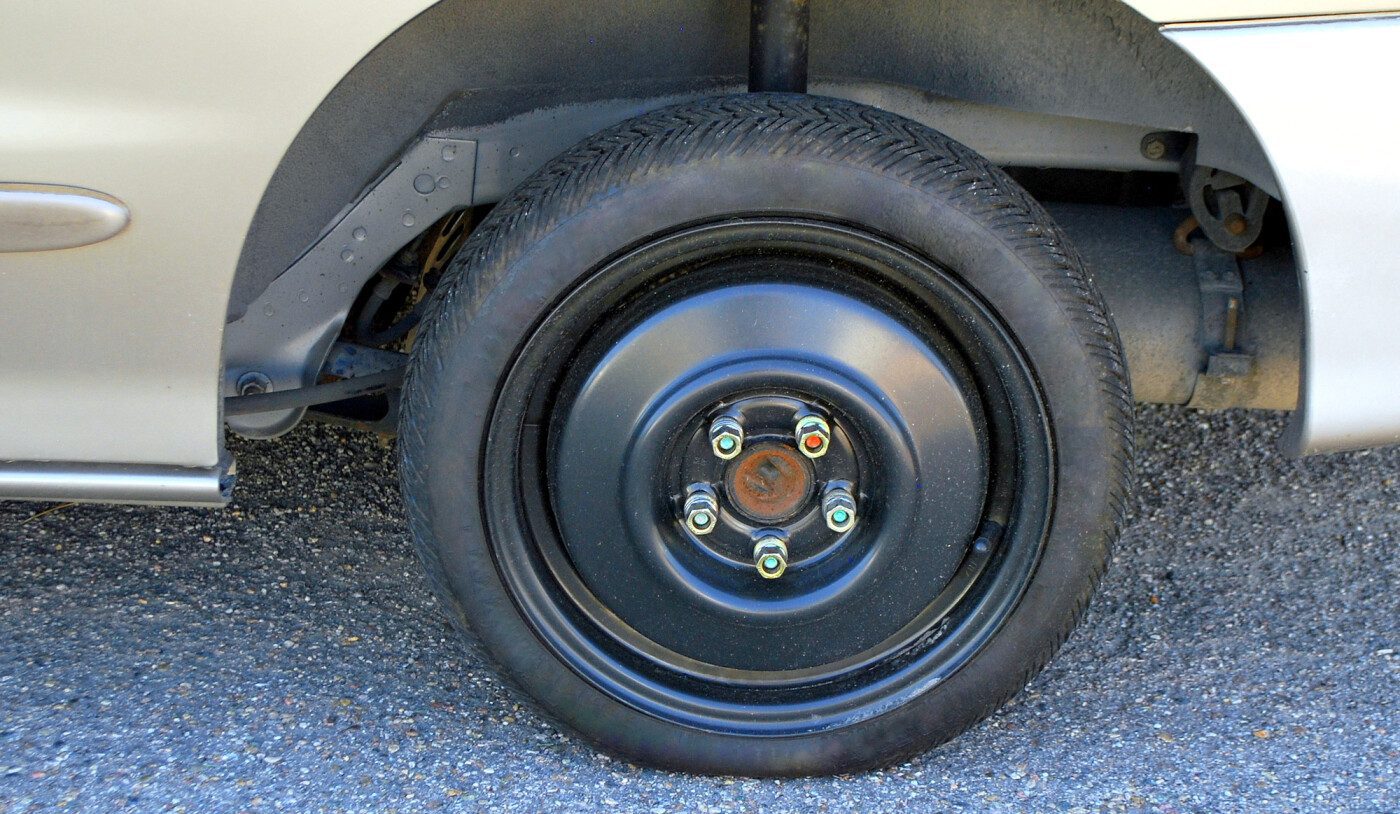 closeup shot of a tire on a silver truck