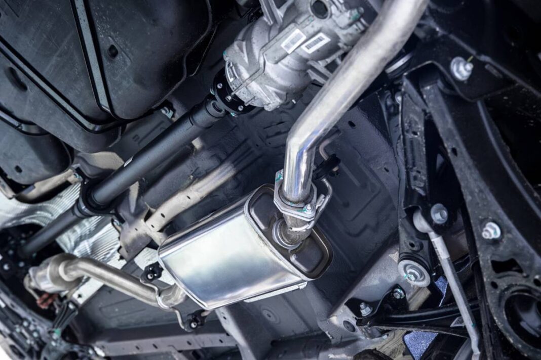 the exhaust pipe under the hood