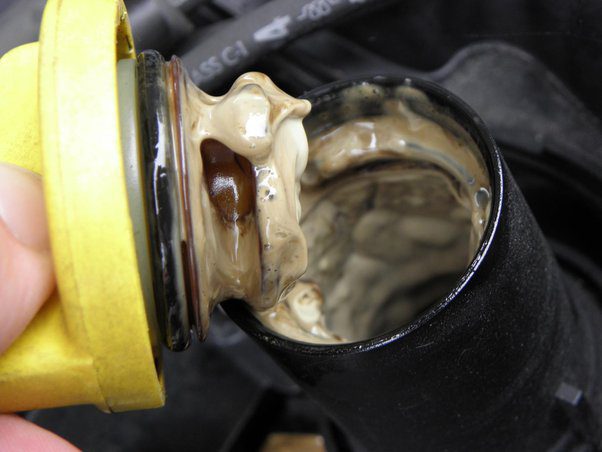 milky engine oil cover