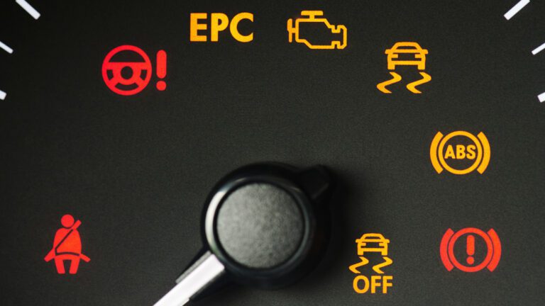 red,and,yellow,car,error,signs,on,dashboard,macro,close