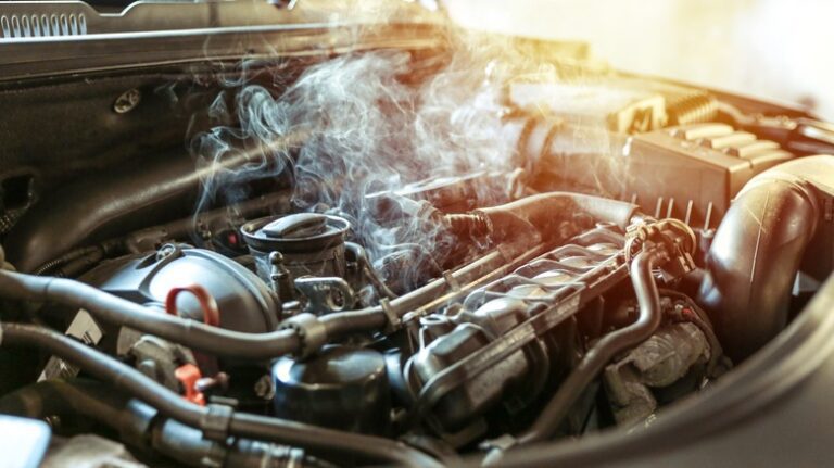 car,engine,overheating,close,up.,vehicle,engine,in,smoke.,smoke