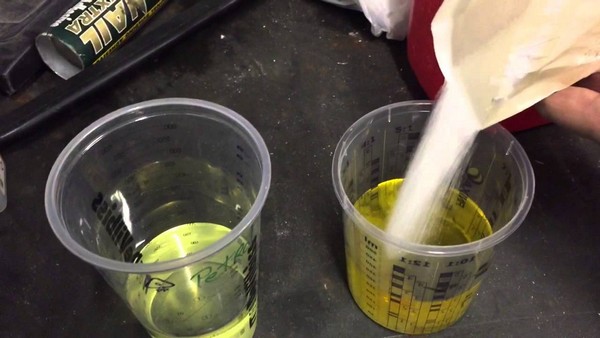 The sugar dissolves in water but goes down to the bottom of the gasoline container sugar-and-water-gasoline-experiment-in-cup