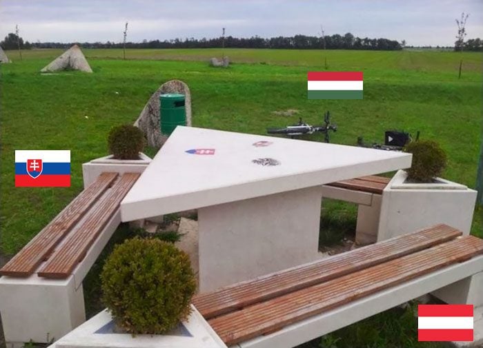 table and chairs at the tripoint where austria, hungary, and slovakia meet