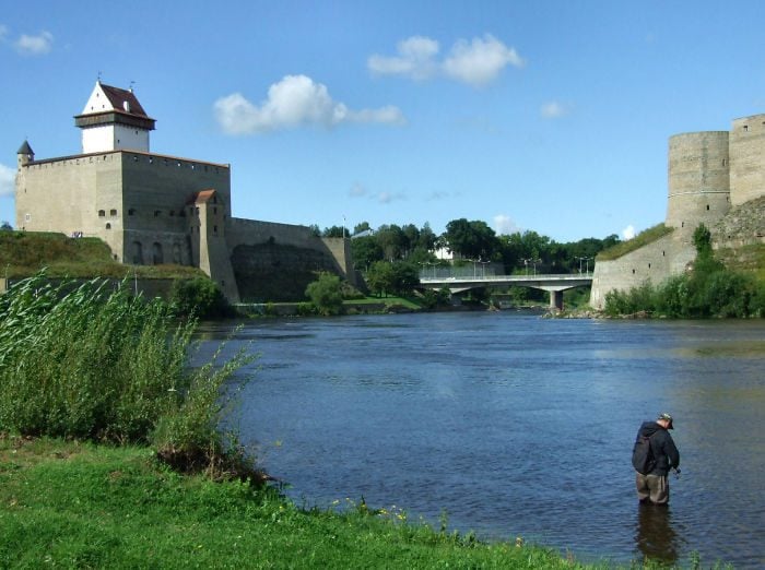 narva river with hermann castle on the estonian side and ivangorod on the russian side