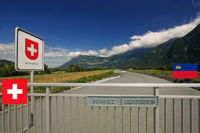view of liechtenstein and switzerland with the rhine river as the border