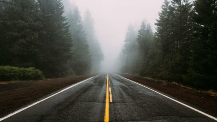 car driving in dense fog