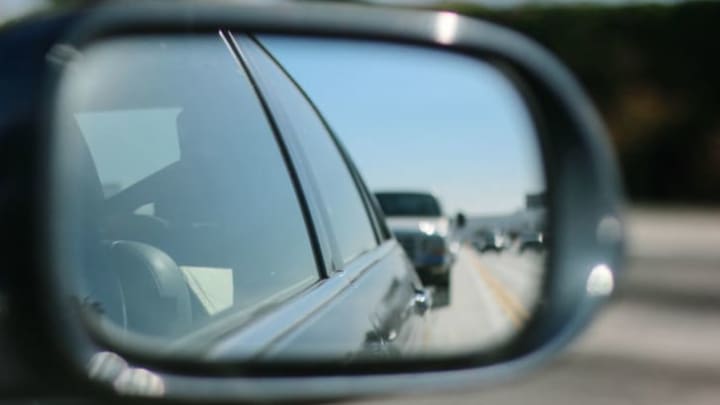 car tailgating on highway