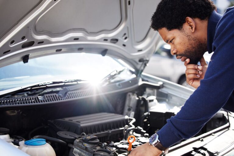 mechanic inspecting car engine