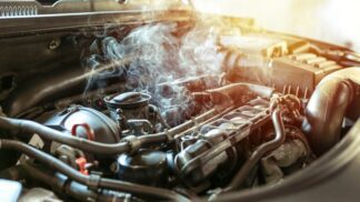 Car,engine,overheating,close,up.,vehicle,engine,in,smoke.,smoke