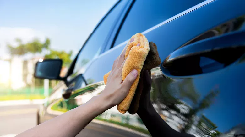 clean car with microfiber towel